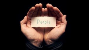 Photo of hands with piece of paper